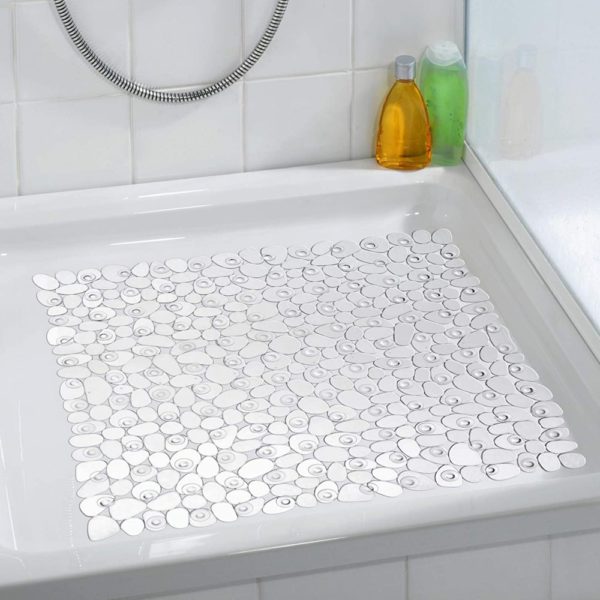 square, plastic shower mat composed of transparent pebble shapes in situ photo on a plain white, square shower tray in a white bathroom