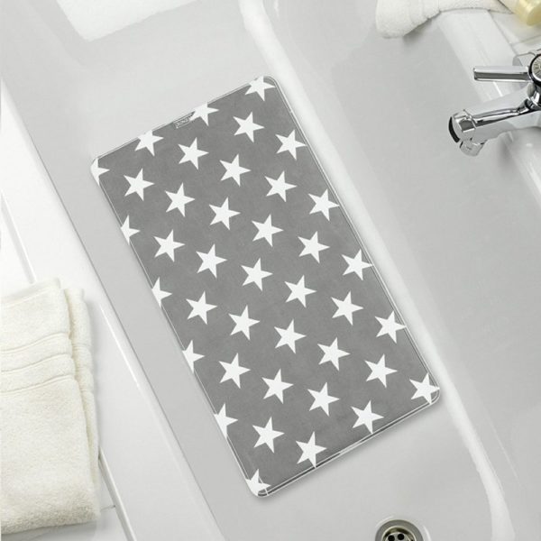 grey rectangular bath mat with a repeating white 5 point star pattern. It is centred in a white bathtub