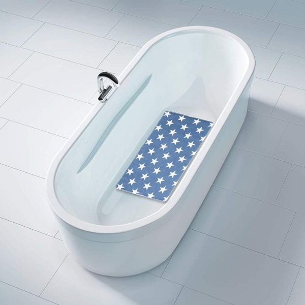 blue rectangular bath mat with a repeating white 5 point star pattern. It is centred in a white bathtub