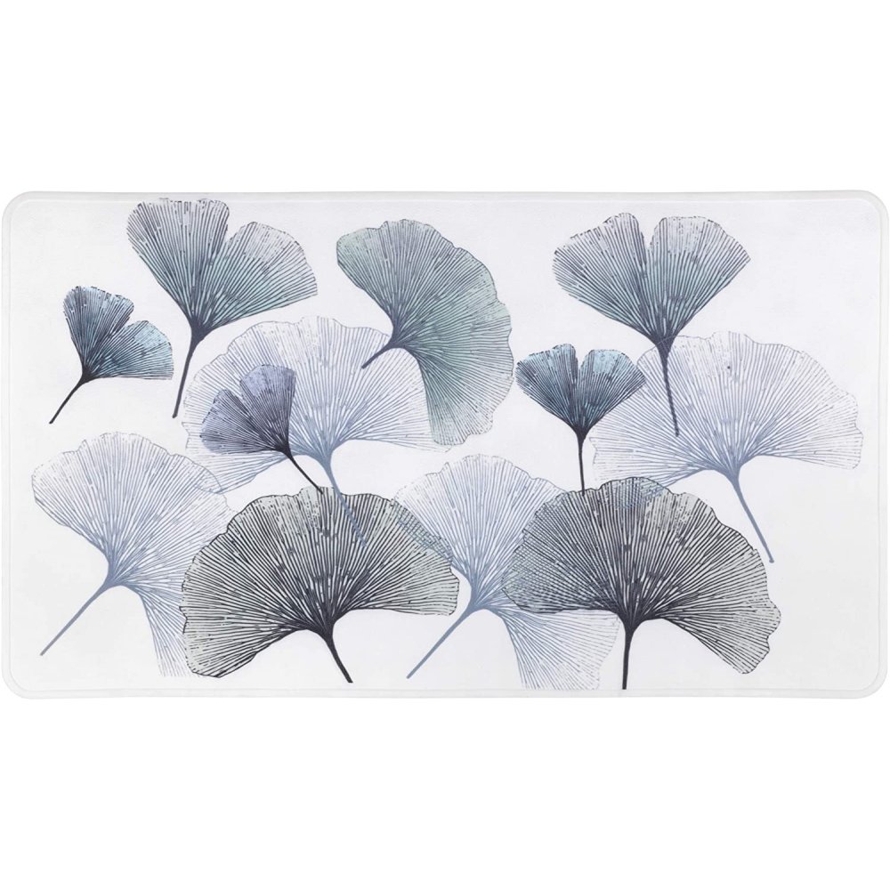 a white, rectangular bath mat multiple , overlapping gingko leaves in varying shades of grey