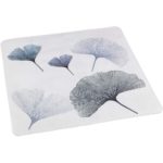 a white, square shower mat multiple , overlapping gingko leaves in varying shades of grey