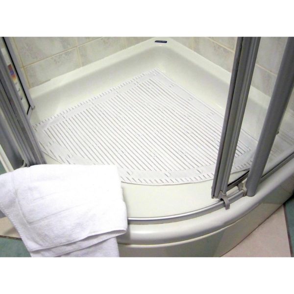 A corner shower cubicle is shown from an elevated position to show the shower tray clearly, on it is a plain white quadrant shaped shower mat, a white towel is paced on the edge of the tray