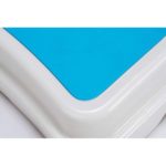 close up of rectangular white bath step with a blue surface on the top