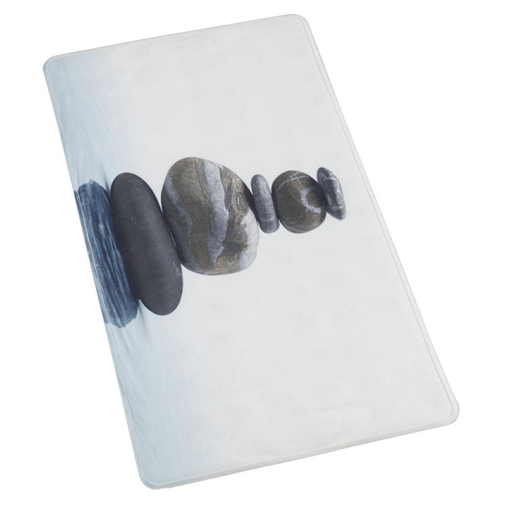 White, rectangular bath mat with a slight blue-grey gradient on the bottom with ripples, indicating water. In the centre is a neat stack of five grey pebbles balanced on top of each other, the two on the bottom are somewhat wider than the top three