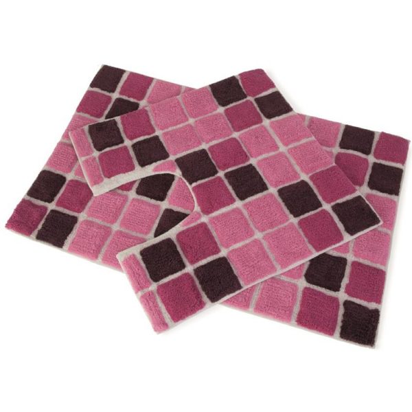 set of 2 bath mats with a square pattern of multiple shades of pink laid on top of each other, the bottom one is larger and rectangular whilst the one on top is square with a d shaped section cut out of one side to allow for toilet
