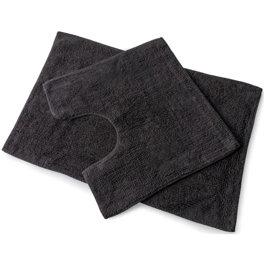 set of 2 slate coloured bath mats laid on top of each other, the bottom one is larger and rectangular whilst the one on top is square with a d shaped section cut out of one side to allow for toilet