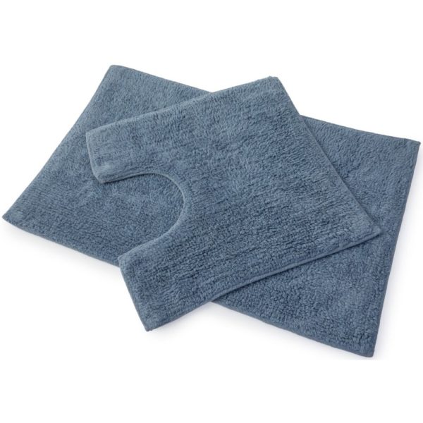 set of 2 slate blue bath mats laid on top of each other, the bottom one is larger and rectangular whilst the one on top is square with a d shaped section cut out of one side to allow for toilet
