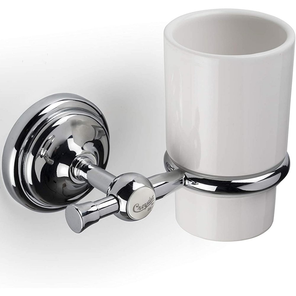 white ceramic tumbler with a chrome holder, on the front of the holder is a white circle with the text "Croydex est 1919"