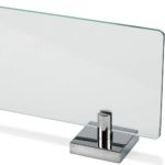 close up of one end of a glass rectangular shelf with square wall bracket
