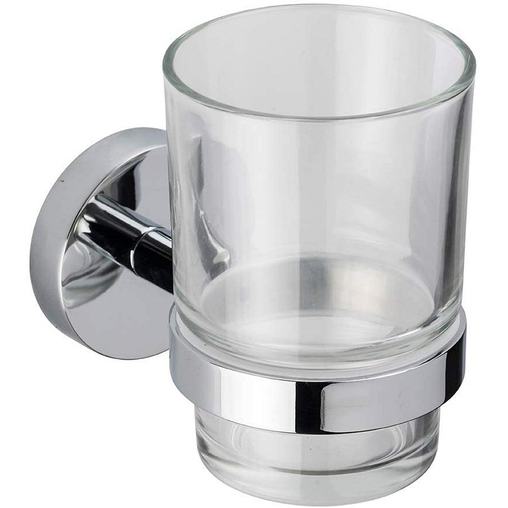 transparent glass tumbler held from the bottom by a chrome wall mounted holder