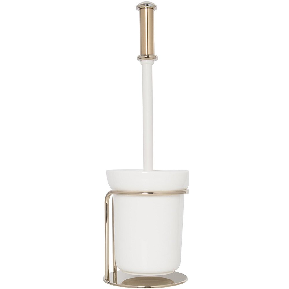 white, ceramic brush holder in a gold coloured holder with a white brush handle with a gold coloured end
