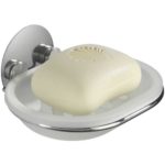translucent white soap dish held by a chrome holder, in the soap dish is a white bar of soap.