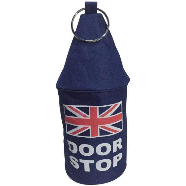 a blue fabric door stop with a pointed tpop and a ring handle. on the side is the union flag. underneath the flag is white, all upercase sans serif font reading 'DOOR STOP'