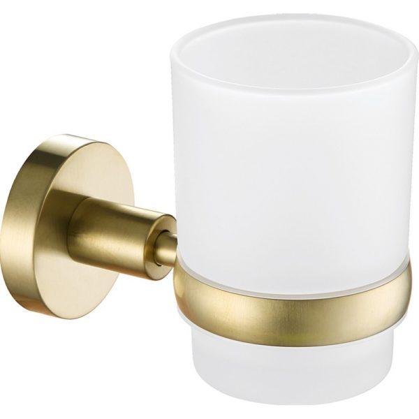 brushed brass wall mounted tumbler holde, it is holding a round white frosted glass tumbler