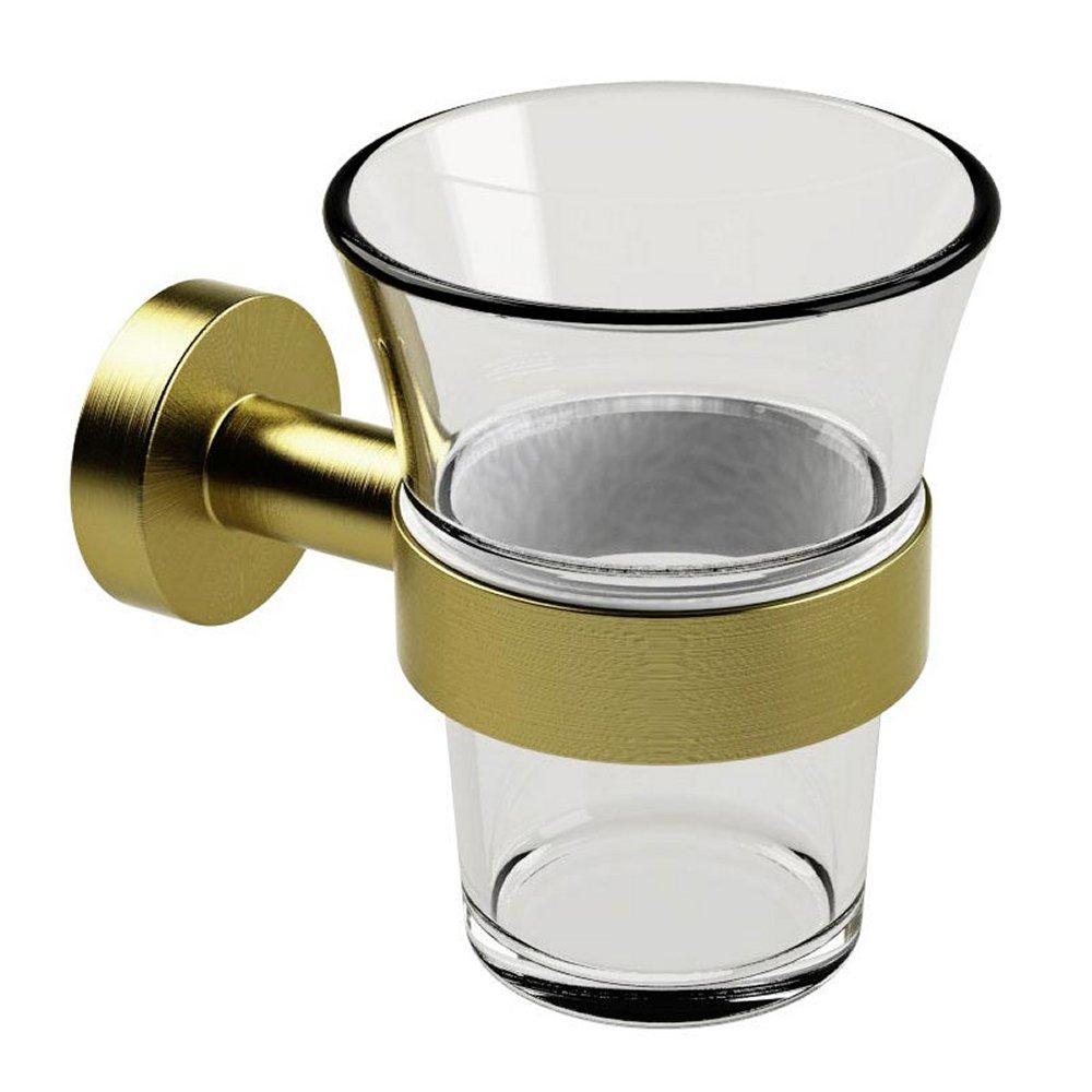 brushed brass tumbler holder with circular wall mount holding a clear glass tumbler