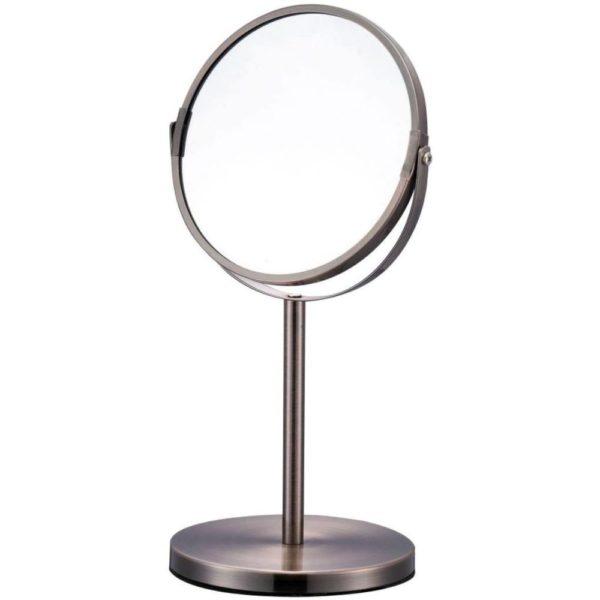 round mirror with swivel hinges on a thin stand with round base, the non mirror parts have an antique brass finish