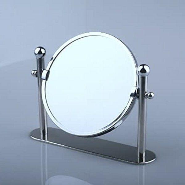 chrome mirror with swivel hinges held up by two posts on a long rectangular base with rounded ends