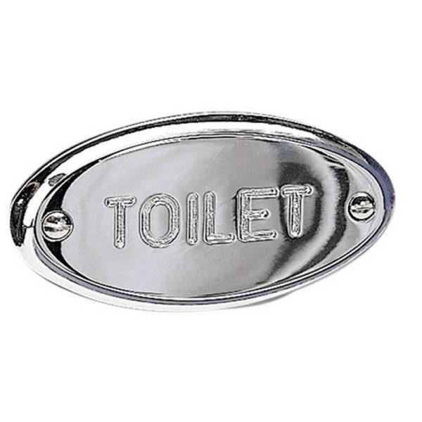 chrome oval sign with the word 'TOILET' engraved on it in upper case in a sans-serif font.