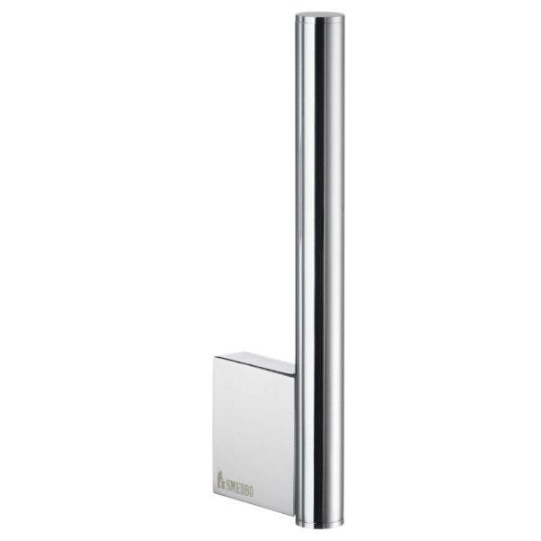 chrome wall mounted spare roll holder, it is a short vertical post attached to the wall via an blocky rectangular wall mount