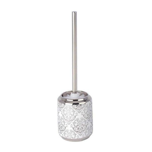 silver and white coloured in brush holder holding a brush with a straight chrome handle. the holder is white and has a baroque style pattern in silver.